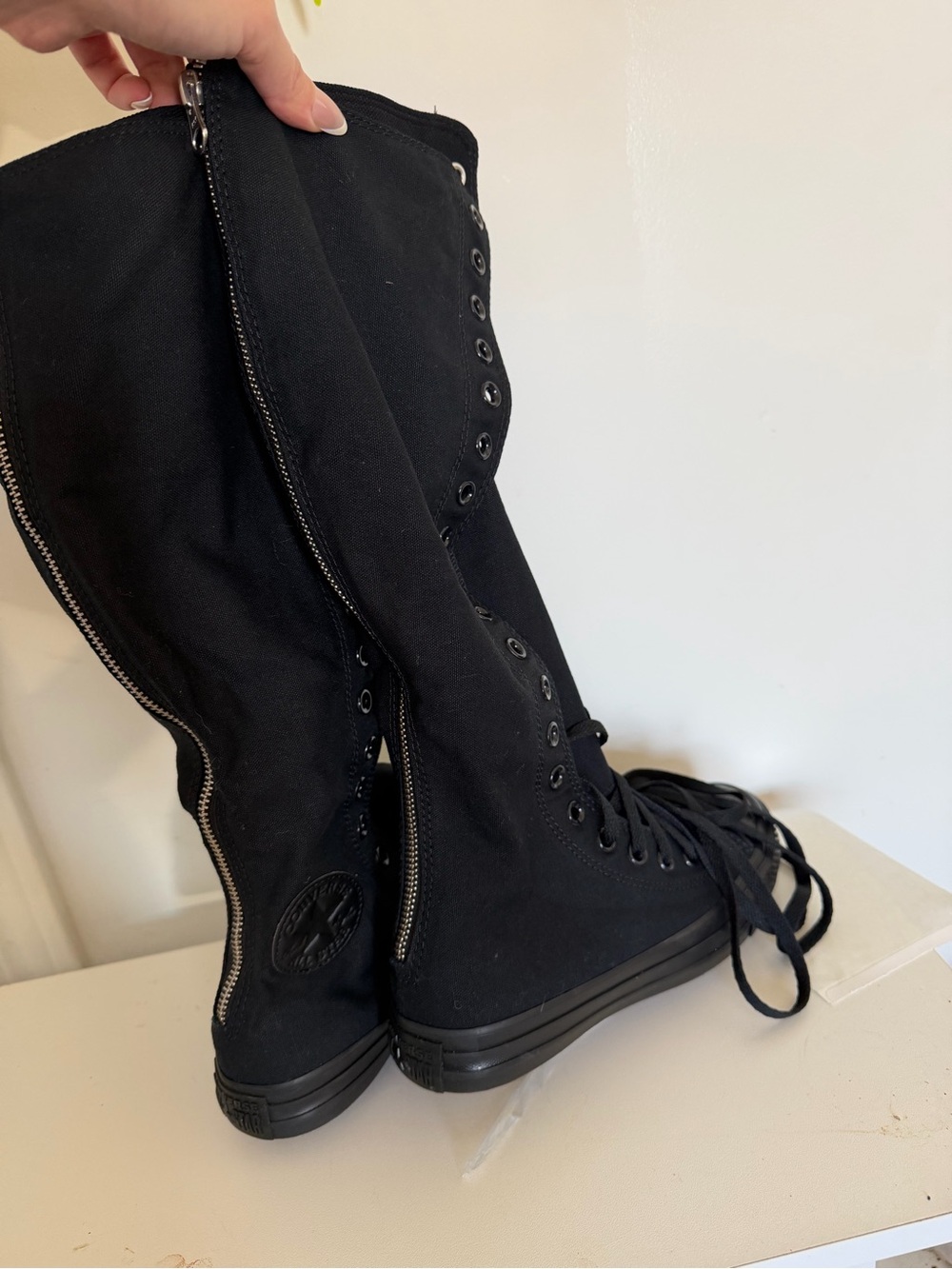 Black high converse sneakers